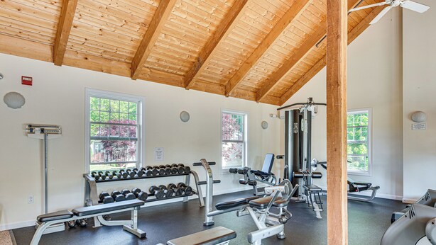 A gym with various exercise equipment, large windows, and a wooden ceiling. - 1 Mi to Beach: Cottage w/ Pool Access in Wells (Wells)