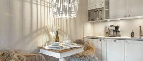 Fridge, stovetop, dishwasher, coffee/tea maker