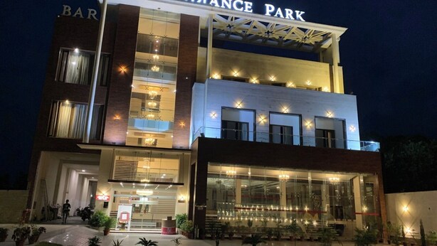 A multi-story building with the name "Radiance Park" prominently displayed at the top. - HOTEL RADIANCE PARK RAMPUR (Rampur)
