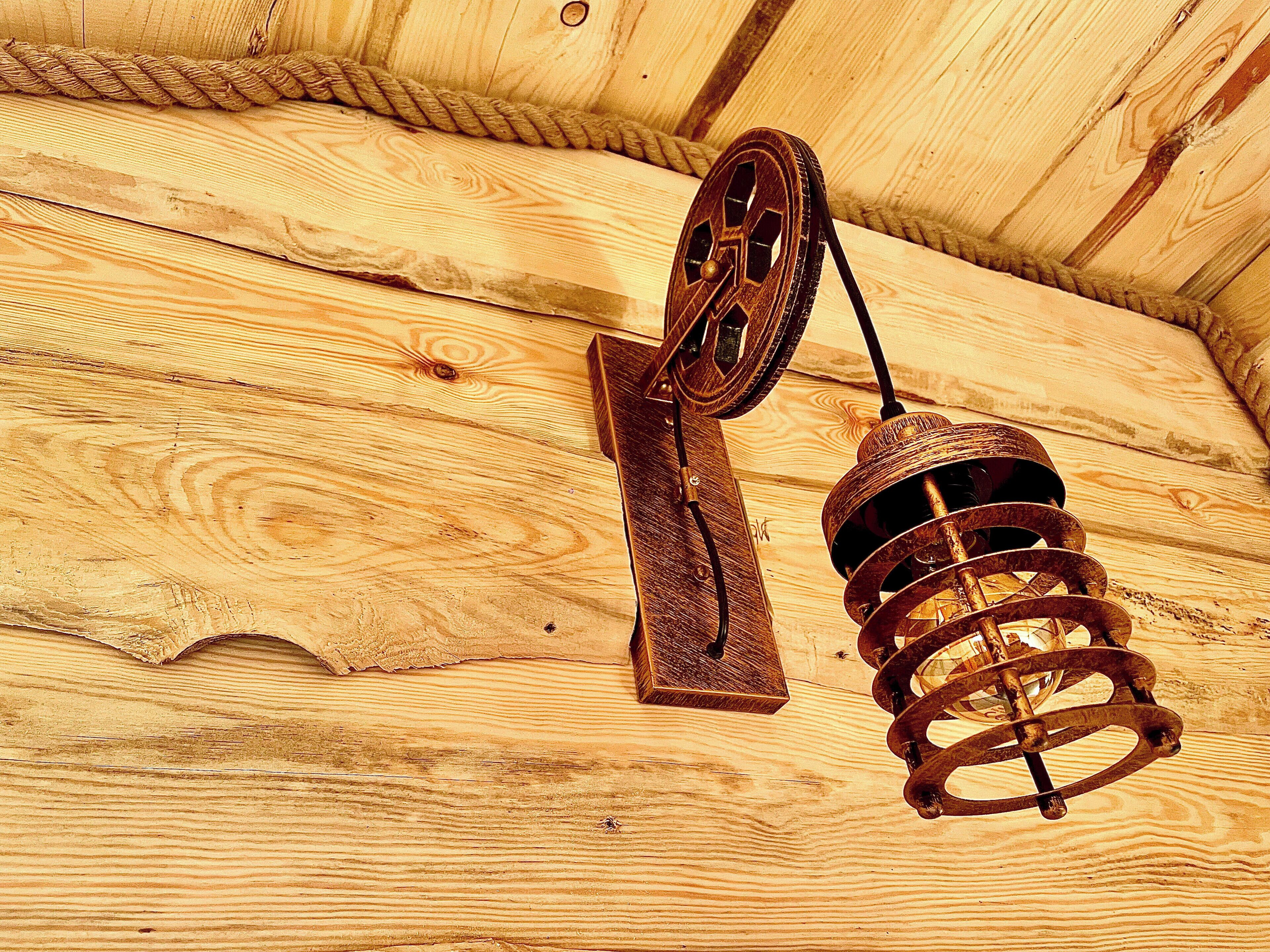 A rustic wooden ceiling with a vintage-style hanging light fixture.