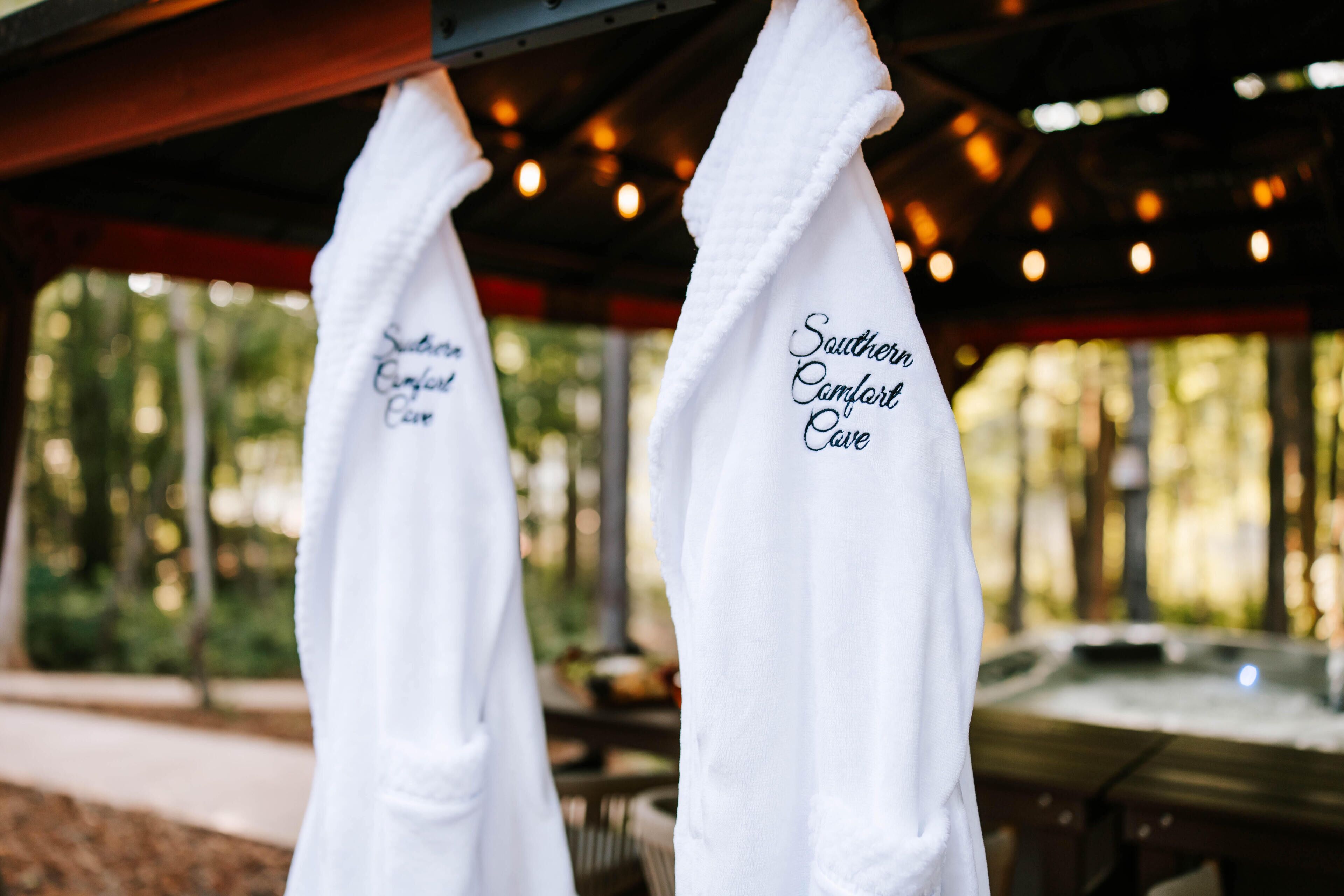 Two white towels hanging with 'Southern Comfort Cove' text.