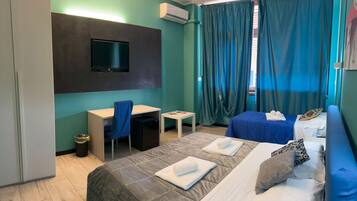 Desk, laptop workspace, blackout curtains, iron/ironing board