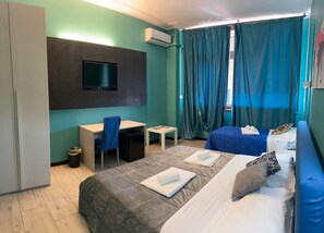 Desk, laptop workspace, blackout drapes, iron/ironing board