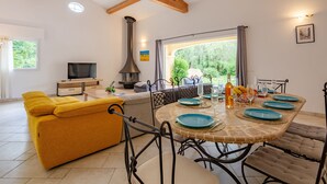 A modern living room with a sofa, TV, and a fireplace. - La Pimaleanne by Interhome (Roquefort les Pins)