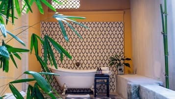 Separate bathtub and shower, free toiletries, hair dryer, slippers