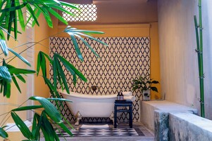 Separate tub and shower, free toiletries, hair dryer, slippers