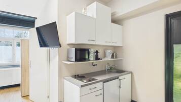 Fridge, microwave, stovetop, coffee/tea maker