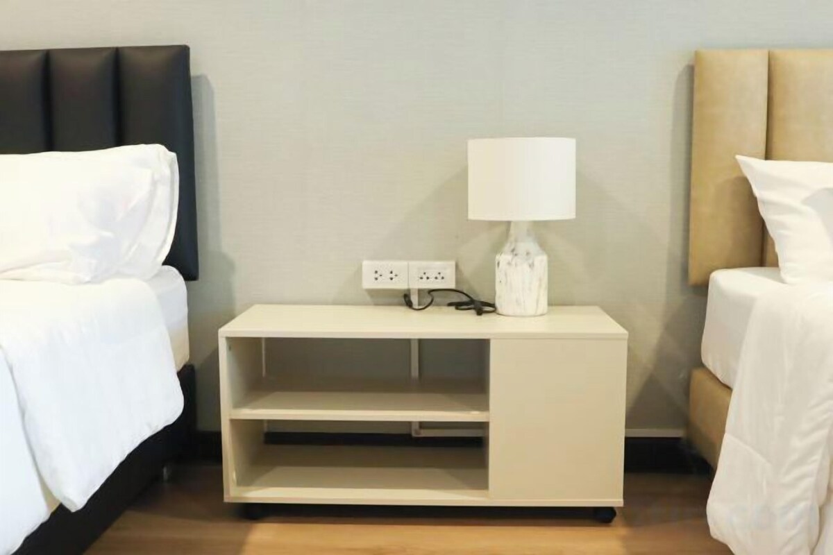 Premium bedding, laptop workspace, blackout curtains