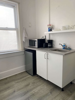Microwave, stovetop, coffee/tea maker, electric kettle