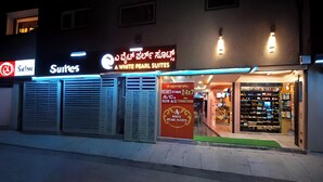 A hotel named 'A White Pearl Suites' with a signboard and a visible entrance. - A White Pearl Suites (Bengaluru)