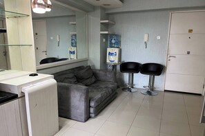 Apartment, 2 Bedrooms | Living area | 32-inch flat-screen TV with cable channels - Apartment Bassura City by Berkah Estate (Jakarta)
