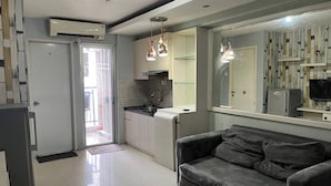 A modern kitchen with a built-in stove, a sink, and pendant lighting.