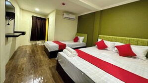 A hotel room with two beds, a mirror, an air conditioning unit, and a wooden floor. - Hotel MSP Bukit Bintang (Kuala Lumpur)