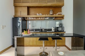Fridge, microwave, stovetop, cookware/dishes/utensils