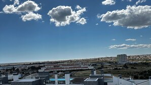 A modern building with multiple floors, large windows, and a flat roof. - Lovely Studio (Faro)