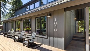 A modern building with a deck area featuring outdoor seating and a number '1020' on the wall. - Lake Daze in Kings Beach (Kings Beach)