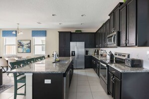 Fridge, microwave, oven, stovetop - ‼️Sun-Kissed 5BR Villa‼️ | Pool & Family Ready (Kissimmee)