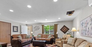 Smart TV, fireplace, books, stereo