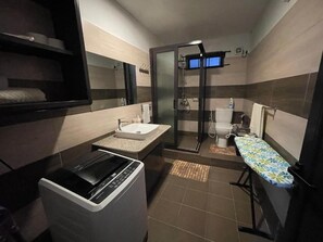 Shower, towels, soap, toilet paper
