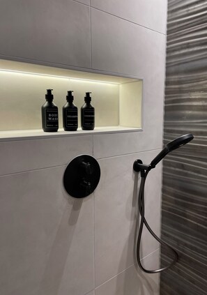 Shower, hair dryer, towels, soap