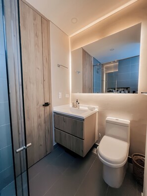 Shower, hair dryer, towels, soap
