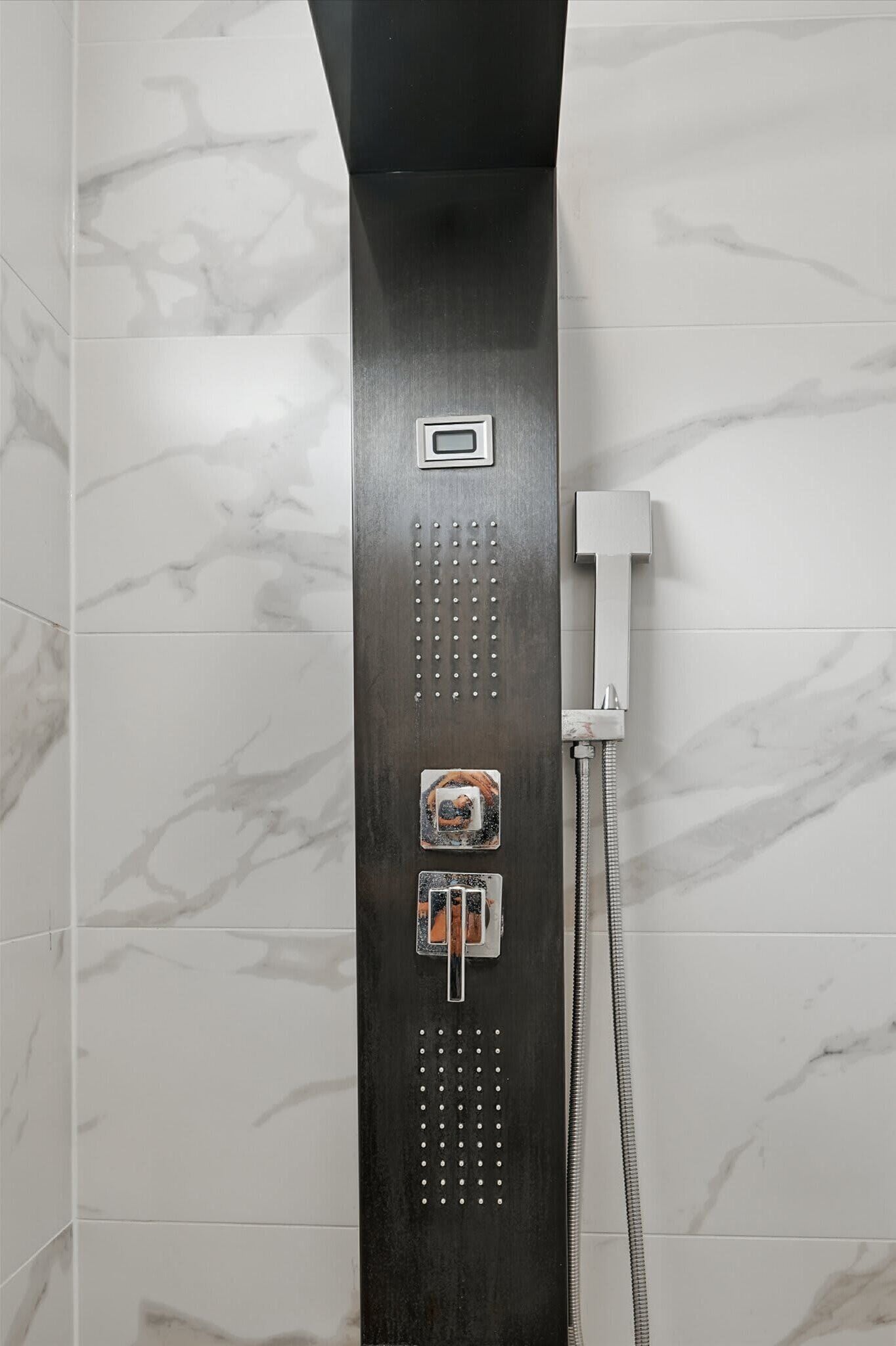 Shower, hair dryer, towels, shampoo