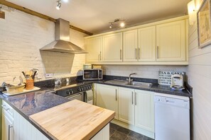 Fridge, stovetop, dishwasher, coffee/tea maker