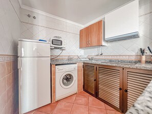 Appartement, 2 chambres, fumeur, patio | Blanchisserie