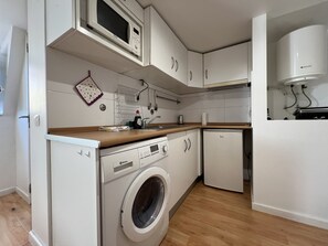 Fridge, microwave, cookware/dishes/utensils, dining tables