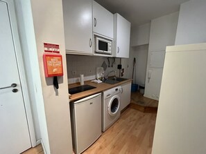 Fridge, microwave, cookware/dishes/utensils, dining tables