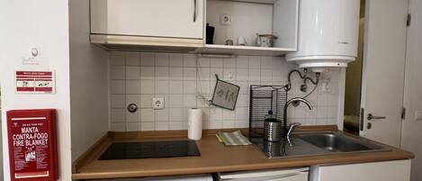 Fridge, microwave, cookware/dishes/utensils, dining tables