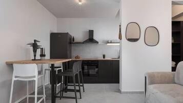 Classic Apartment, Sea View | Living area | 50-inch Smart TV with digital channels