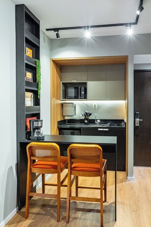 Fridge, microwave, stovetop, coffee/tea maker