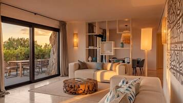 Luxury Suite, 3 Bedrooms, with Garden | Living area | 50-inch Smart TV with digital channels, iPad, first-run films