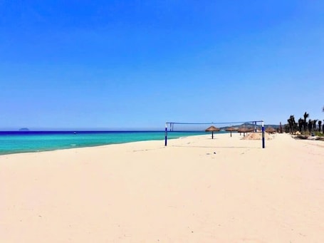 On the beach, white sand, free beach cabanas, sun-loungers