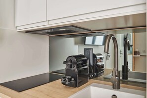 Fridge, coffee/tea maker, cookware/dishes/utensils