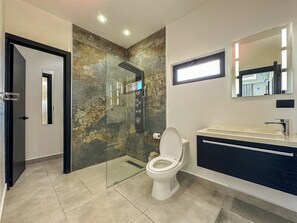 Shower, hair dryer, towels, toilet paper