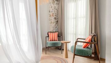 Deluxe Romantic Oda | Living area | 75-inch plasma TV with satellite channels