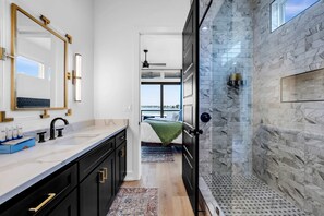 Shower, hair dryer, towels, shampoo