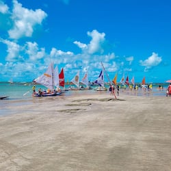 On the beach, white sand, sun-loungers, beach umbrellas
