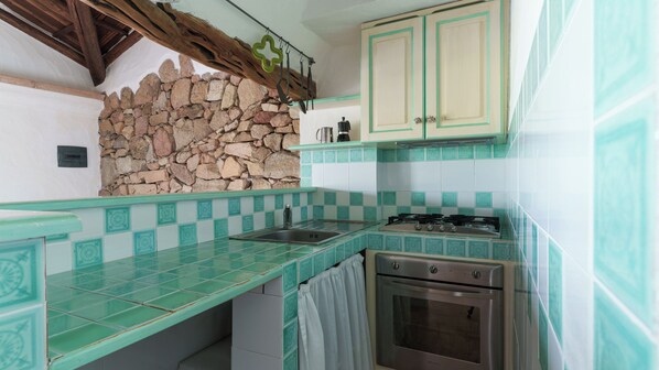 Fridge, stovetop, cookware/dishes/utensils, dining tables