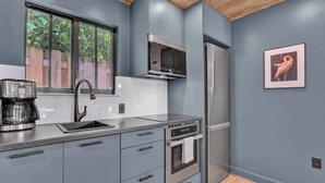 Coffee/tea maker, fridge, microwave, oven