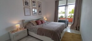 1 bedroom, desk, iron/ironing board, travel crib