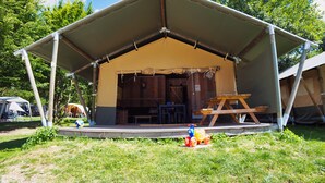 A tent with a covered porch, a picnic table, and a small play area with toys. - Camping 2000 - Sahara tent XXL (Osecná)