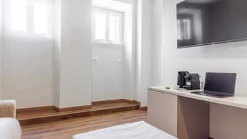 Deluxe Suite, Balcony, City View | Living room | 55-inch Smart TV with digital channels, Netflix, streaming services