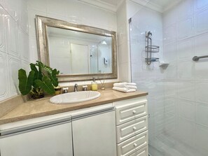 Shower, towels, soap, toilet paper