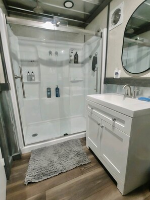 Shower, hair dryer, towels, soap