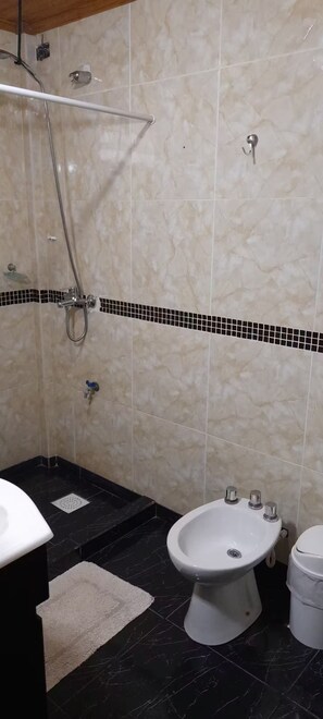 Shower, towels, soap, toilet paper