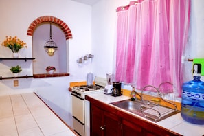 Fridge, microwave, stovetop, coffee/tea maker