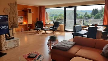 Smart TV, fireplace, table football, books